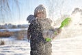 Baby boy walking at snowfall. Child in winter clothes playing with snow Royalty Free Stock Photo