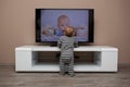 Baby boy watching television Royalty Free Stock Photo