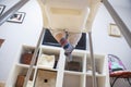 Baby boy watching tv on his highchair Royalty Free Stock Photo