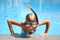 Baby boy in the water mask in the pool. Child swimmer in the water autdoor. Royalty Free Stock Photo