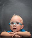 Baby boy wearing glasses with a clever look. Royalty Free Stock Photo