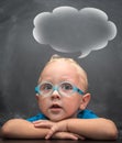 Baby boy wearing glasses with a clever look. Royalty Free Stock Photo