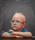 Baby boy wearing glasses with a clever look. Royalty Free Stock Photo