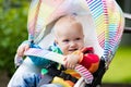 Baby boy in white stroller Royalty Free Stock Photo