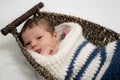 Baby boy in a wicker basket Royalty Free Stock Photo