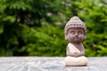 Baby Budda Statue, Teacher or yoga master. Little monk. Meditation and zen, relaxation concept