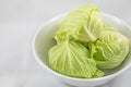 Baby Cabbage in a White Bowl