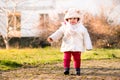 Baby cap with ears newborn walking park winter dressed first ste Royalty Free Stock Photo