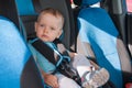 Baby in car seat for safety, looking outside Royalty Free Stock Photo