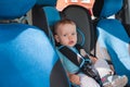 Baby in car seat for safety, looking outside Royalty Free Stock Photo