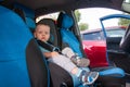 Baby in car seat for safety, looking outside Royalty Free Stock Photo