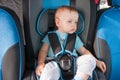 Baby in car seat for safety, looking outside Royalty Free Stock Photo