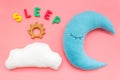 Baby care concept with moon pillow, clouds, sleep copy and toy for sleep of newborn on pink background top view Royalty Free Stock Photo