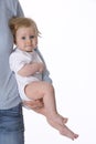 Baby carried by parent Royalty Free Stock Photo