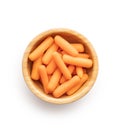 Baby carrot vegetable in bowl. Mini orange carrots isolated on white background