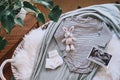 Baby changing basket with ultrasound image, baby bodysuit, knitted rabbit toy. Still life of child products. Newborn background.