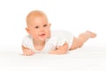 Baby with cheeks in white bodysuit laying alone