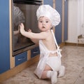 Baby chef cooks in the oven food Royalty Free Stock Photo