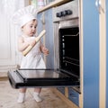 Baby chef cooks in the oven food Royalty Free Stock Photo
