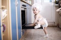 Baby chef cooks in the oven food Royalty Free Stock Photo