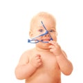 Baby chewing glasses. Royalty Free Stock Photo