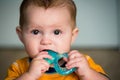 Baby chewing on teething ring Royalty Free Stock Photo