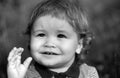 Baby child boy enjoy the summer on the nature in the park outdoor. Baby face close up. Funny little child closeup Royalty Free Stock Photo