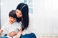 Baby child boy kindergarten playing toy with beautiful mother Royalty Free Stock Photo