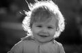 Baby child enjoy the summer on the nature in the park outdoor. Baby face closeup. Funny little child close up portrait Royalty Free Stock Photo