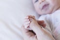 Baby Child holding father`s hand, close up view. love and family concept Royalty Free Stock Photo