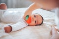 baby child lying on belly weared diaper with teether Royalty Free Stock Photo