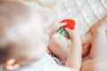 baby child lying on belly weared diaper with teether Royalty Free Stock Photo