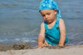 Baby child playing in waves Royalty Free Stock Photo