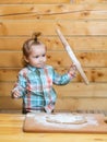 Baby child preparing the dough, bake cookies in the kitchen. Royalty Free Stock Photo