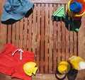 Baby Child summer stuff on a wooden background