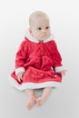 Baby in a Christmas dress Royalty Free Stock Photo