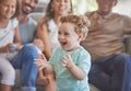 Baby, clapping hands and excited toddler boy feeling happy, playful and cheerful at home with his family showing growth Royalty Free Stock Photo