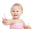 Baby cleaning teeth and smiling, isolated on white