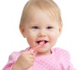 Baby cleaning teeth and smiling, isolated on white