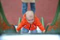 Baby Climbing Up A Slide Royalty Free Stock Photo