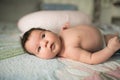 Baby close up. lying on the couch in the parent room. picture of a newborn baby curled up sleeping on a blanket