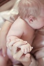 Baby. close-up portrait of little fingers infant in mother hand