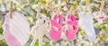 Baby clothes and accessories weigh on the rope after washing in the open air. Selective focus Royalty Free Stock Photo