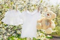 Baby clothes and accessories weigh on the rope after washing in the open air. Selective focus Royalty Free Stock Photo