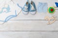 Baby clothes and baby shoes for boy on wooden background. Copy s Royalty Free Stock Photo