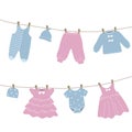 Baby clothes hang on the clothesline. Things are dried on clothespins after washing Royalty Free Stock Photo