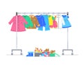 Baby clothes on hanger rack with shoes Royalty Free Stock Photo