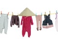 Baby clothes hanging on washing line Royalty Free Stock Photo