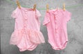 Baby clothes hanging on washing line Royalty Free Stock Photo