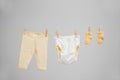 Baby clothes hanging on washing line Royalty Free Stock Photo